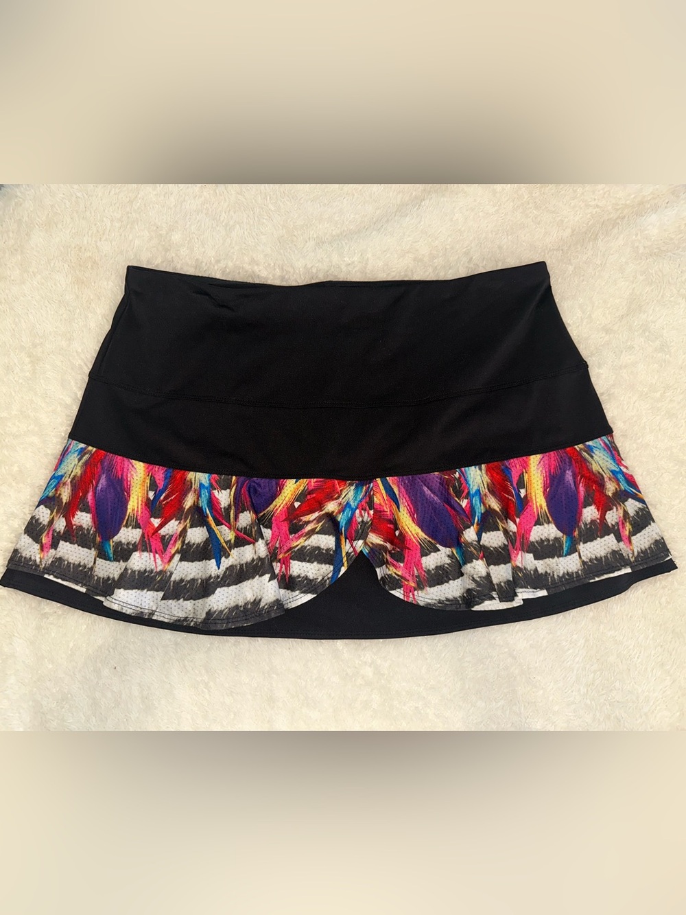 LUCKY IN LOVE Black Tennis Skirt with Vibrant Feather Print Ruffle